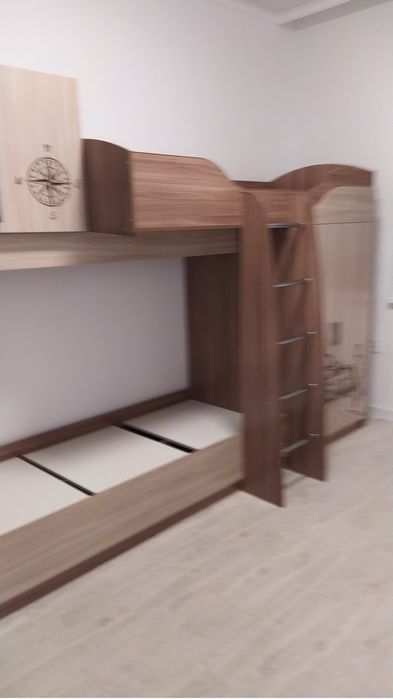Двухъярусная кровать , отличного качества   с вместительными шкафами