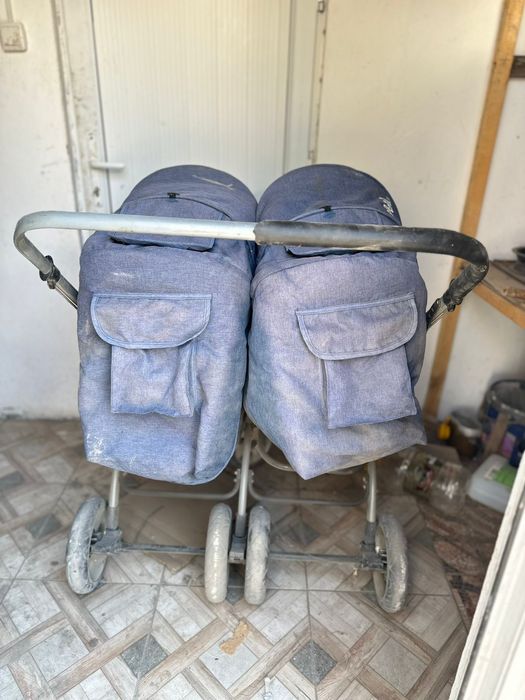 Детская каляска для двоини