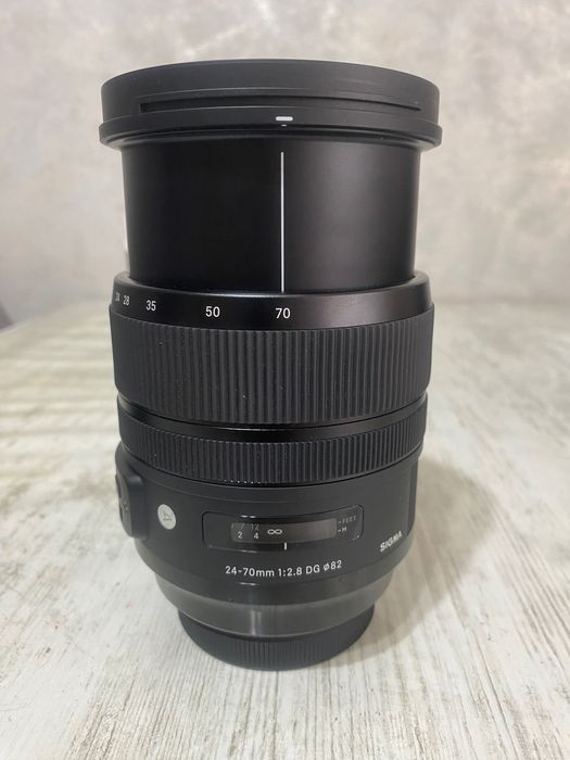 Vând obiectiv Sigma 24–70mm f/2.8 DG Art, montura EF, în garanție