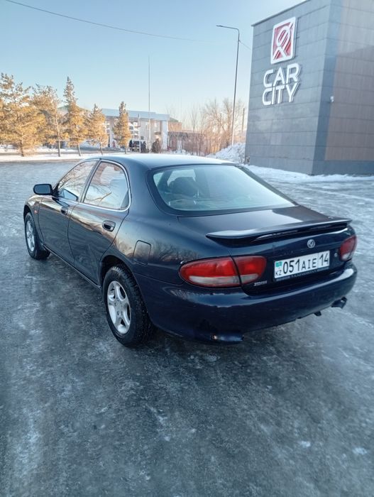 Мазда кседос 6 .