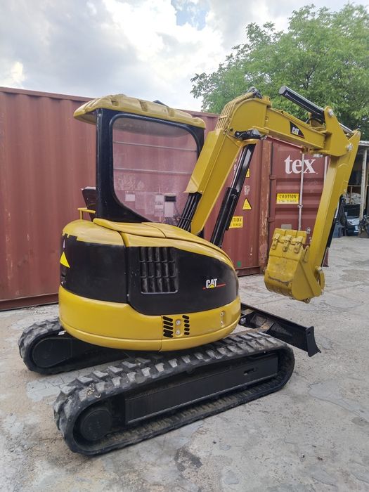 Миниэкскаватор Caterpillar
