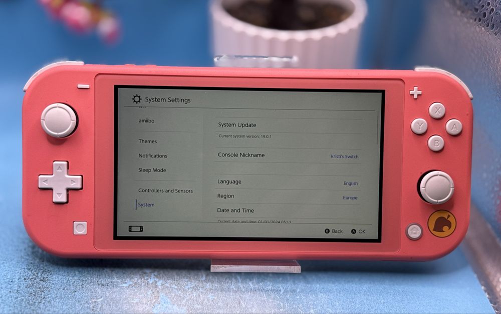 Nintendo Switch Lite (Animal Crossing Edition) + Super Mario Odyssey