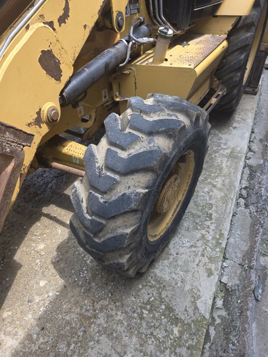 Vand Buldoexcavator Caterpillar