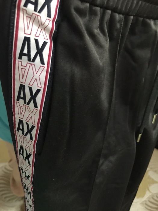 Pantaloni sport, cu capse