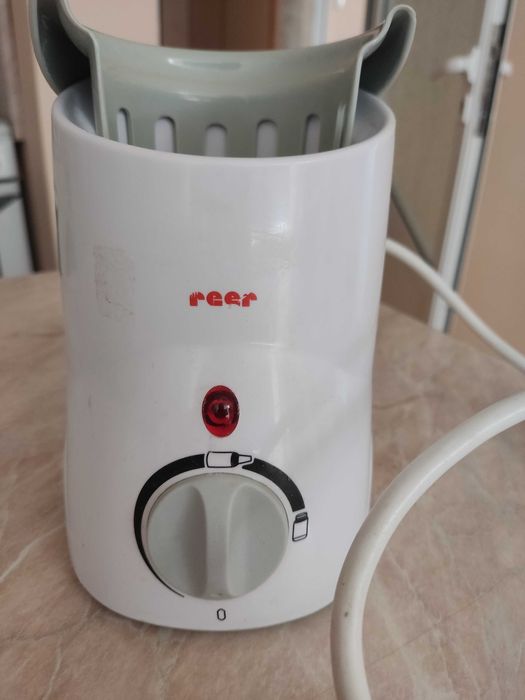 Уред за затопляне на шишета и бурканчета за бебешка храна