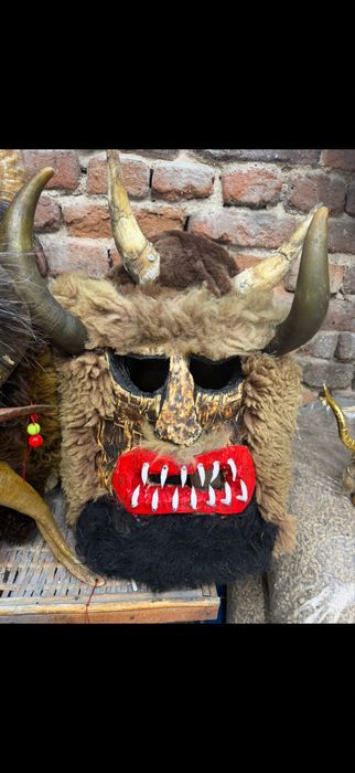 Кукерски маски от кожа и дърво