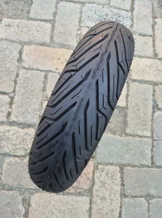 O bucată 110/70 R 13 Michelin Dunlop