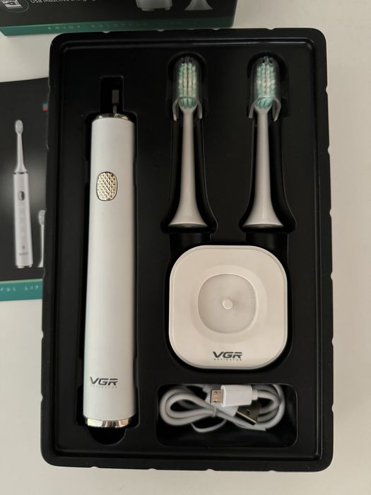 Электрическая зубная щетка