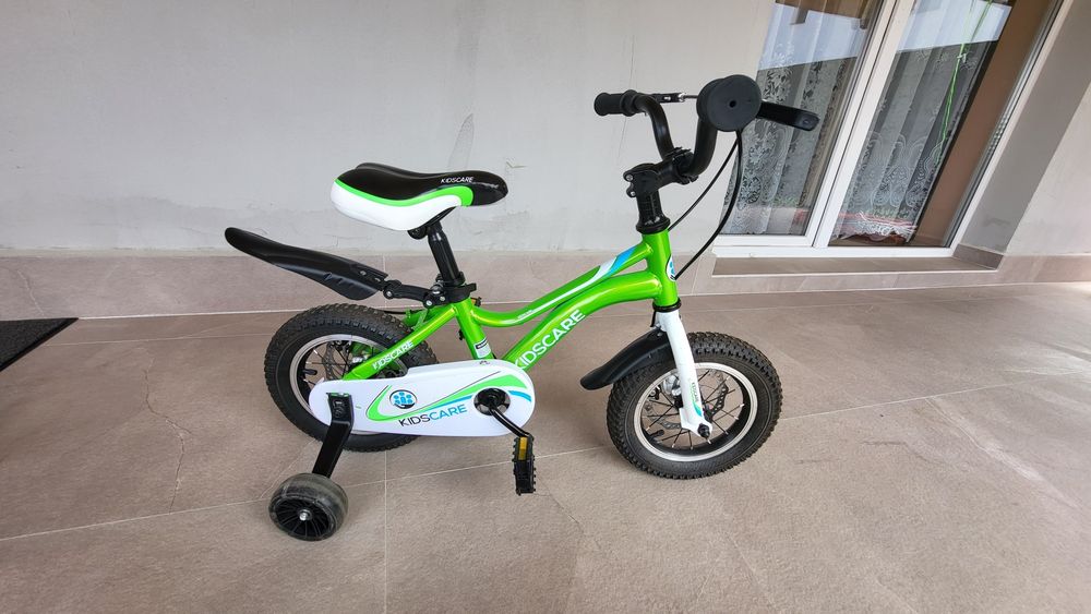 Bicicleta  copii 2-4 aniKidsCare,12 inch
Bicicleta pentru copii 2-4 ani HappyCycles KidsCare, roti 12 inch, cu roti ajutatoare si frane pe disc, verde