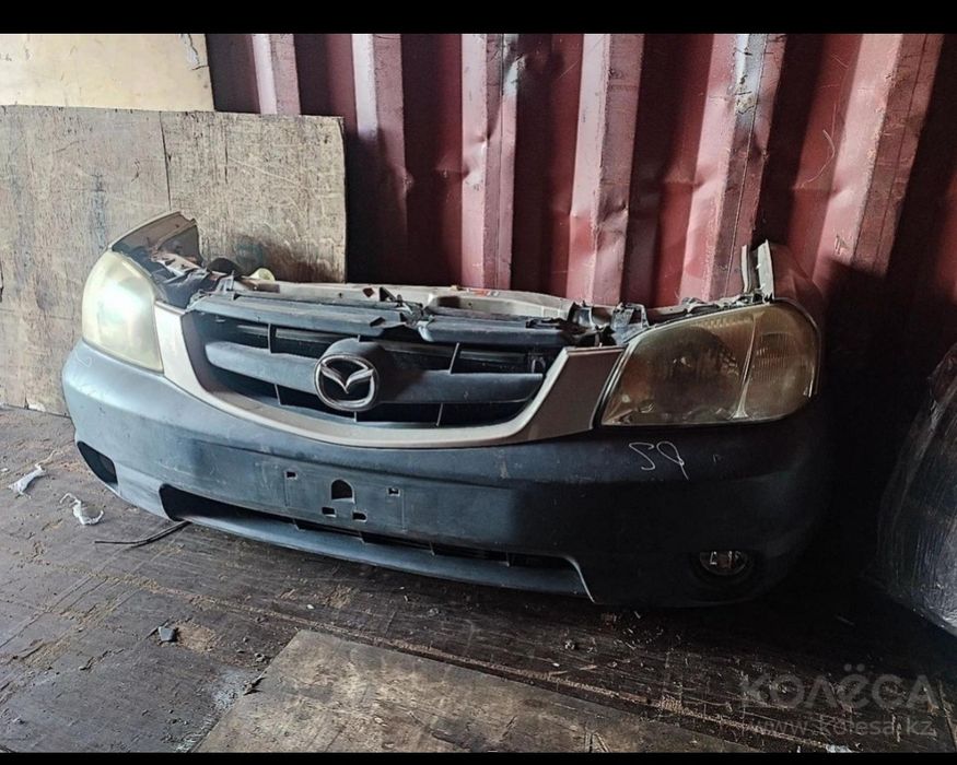 Передняя часть морда Мазда трибут