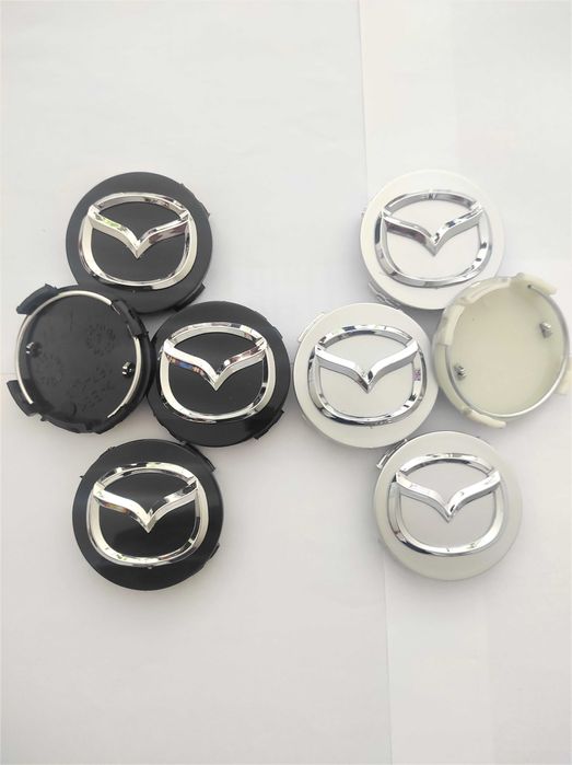Капачки за Джанти за МАЗДА 56 мм. Цвят: Сребристи, червени и черни.