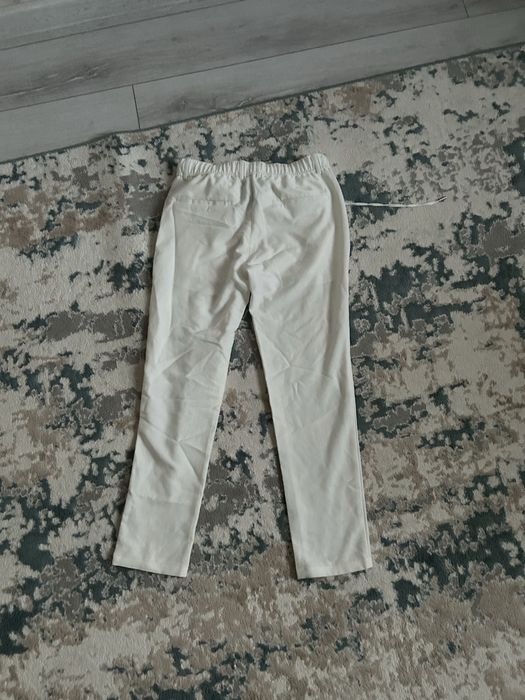 Продам белые брюки