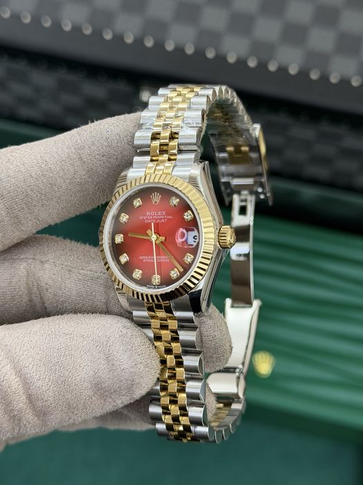 Rolex Datejust 31 Yellow Rolesor – Red Diamond Dial Jubilee