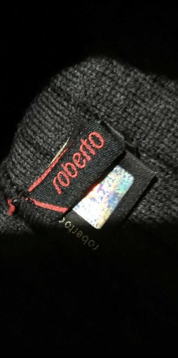 Caciula Roberto Cavali