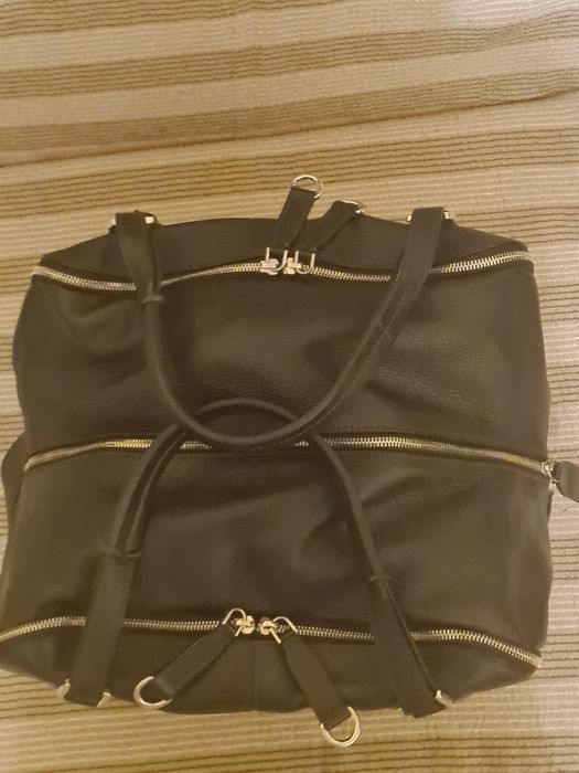 Дамска, пътна чанта от естествена кожа със катинарчета към закопчаващи