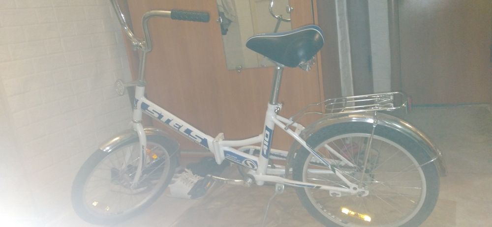 Продам велосипед Стелс почти новый, ролики и др.