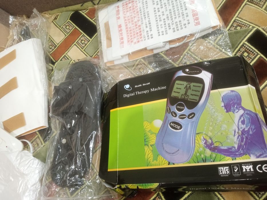 Массажёр для ног с электроподогревом.