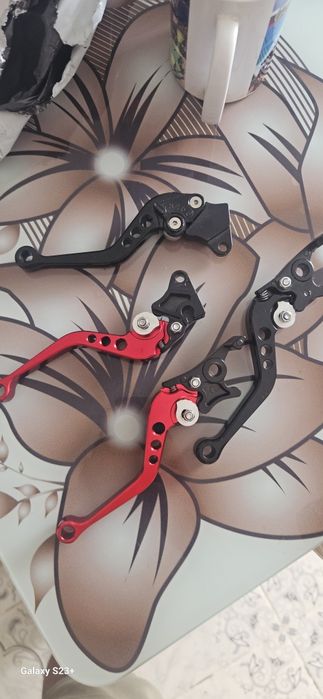 Manete moto din aluminiu 50 lei set ul red sau black.
