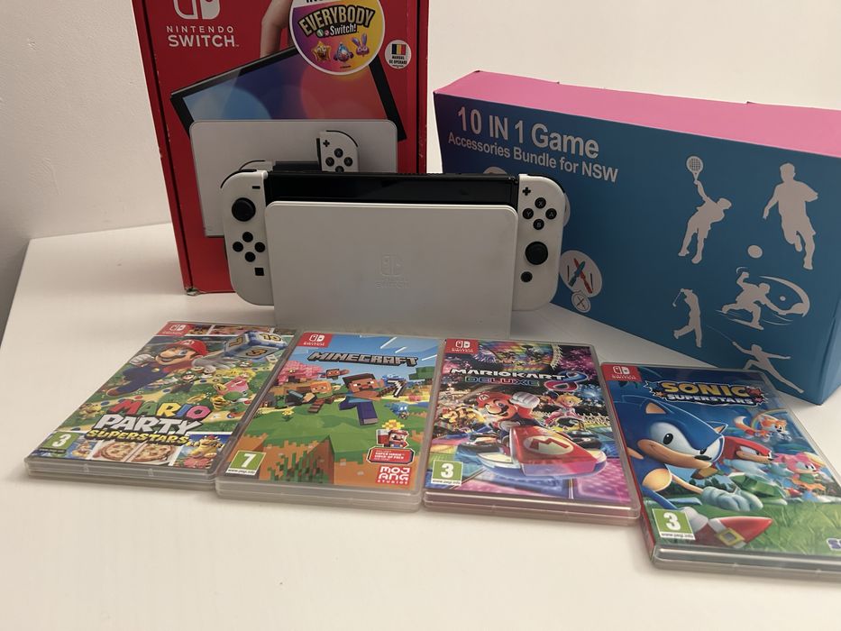 Nintendo Switch OLED + 4 jocuri + accesorii | aproape nou