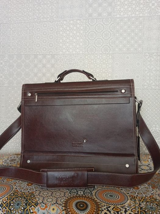 Продам мужской красивый портфель коричневого цвета,кожа,новый.