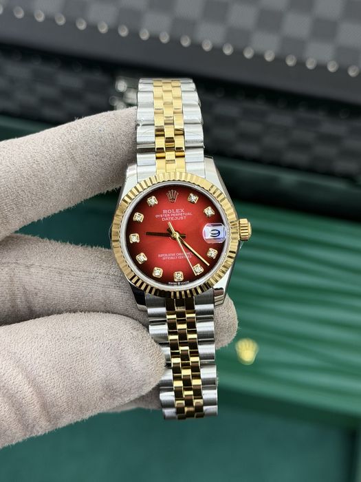 Rolex Datejust 31 Yellow Rolesor – Red Diamond Dial Jubilee