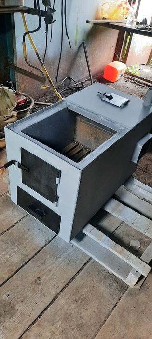 Котёл  отопления твёрдотоплевный