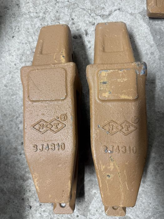 Продам коронки зубья адаптера на экскаваторы