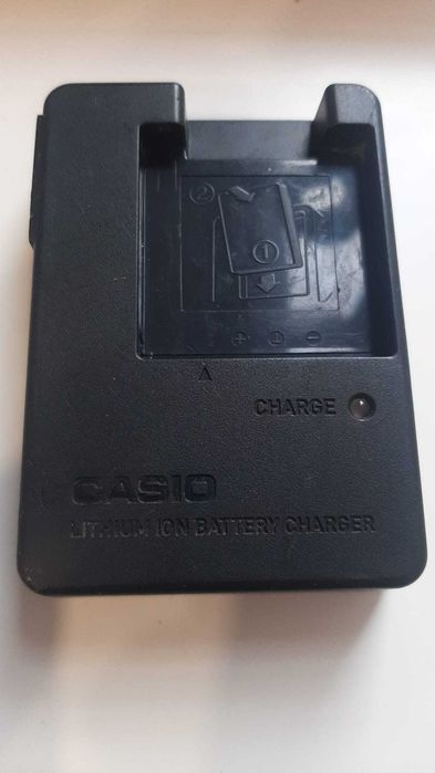 Incărcător extern original Casio BC-60L pentru încărcarea acumulatorilor litiu-ion de tip Casio NP-60