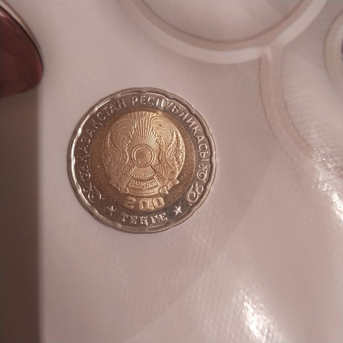 Продам монету с символом