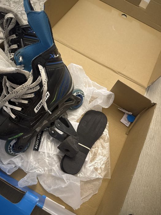 Роликовые коньки