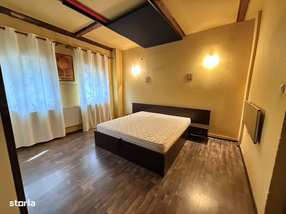 Apartament la curte comuna, 2 camere, 48 mp utili si teren comun 550 m
