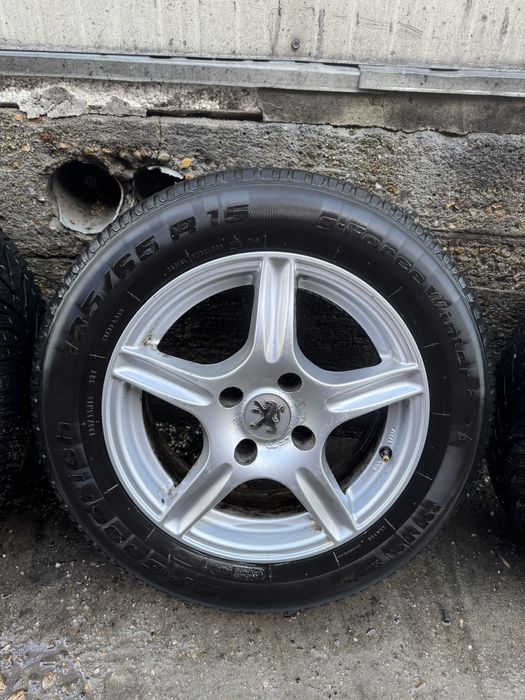 Jante gama Peugeot 185/65/15 cu anvelope de iarna