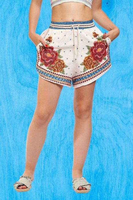 Pantaloni crem cu print floral caramiziu