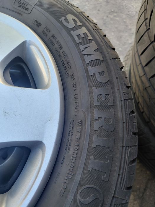 VW Polo  5×100-14" Жл.джанти с гуми+тасове