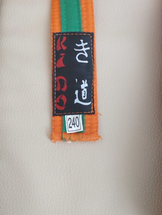 Колан за карате оранжев със зелена лента
