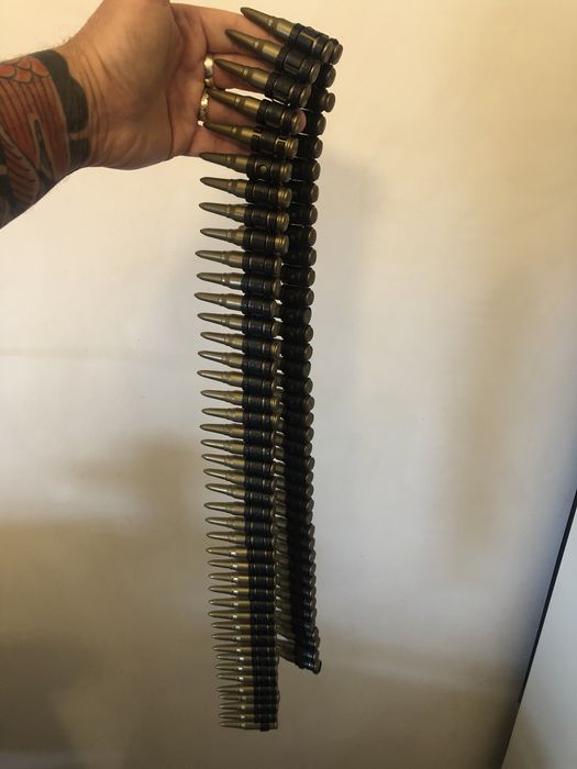 Banda de mitraliera cu 82 cartuse din plastic