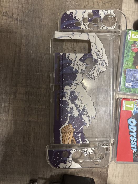 Vand nintendo switch+ accesori si 10 jocuri