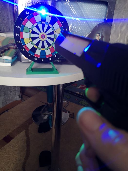 Пистолет лазер с мешенью  музыкалтной