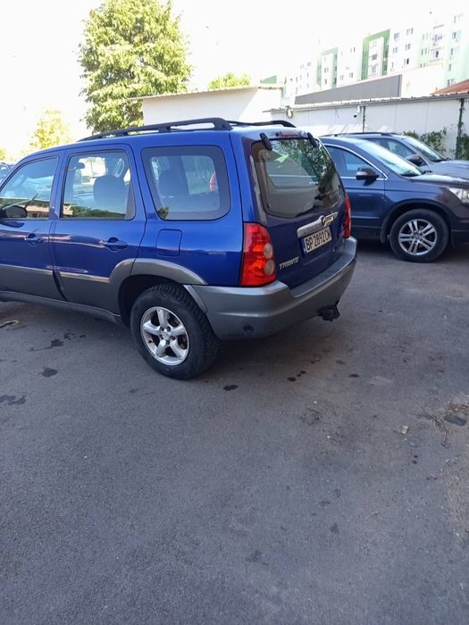 Кола Mazda Tribute