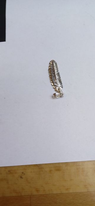 Сребърно авторско перо.