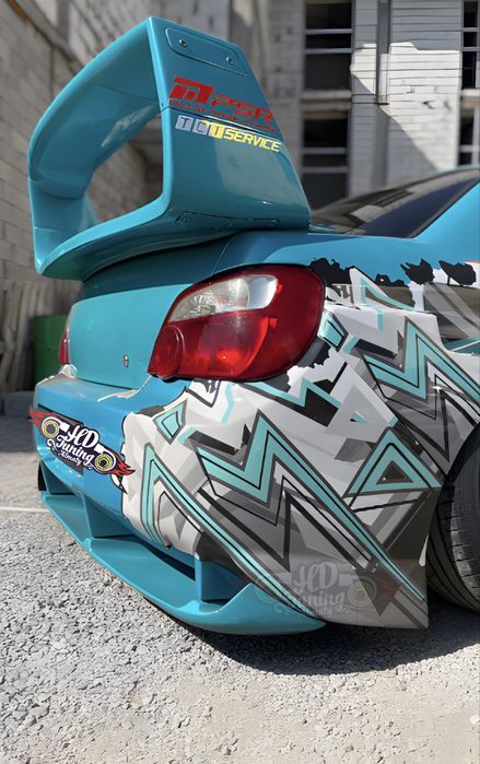 Бампер задний со сплиттером Subaru Impreza GDB