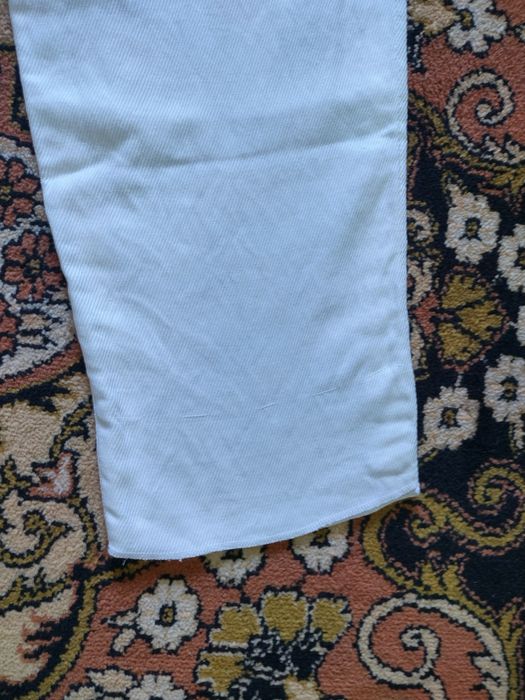 S. Ferré. Pantaloni albi