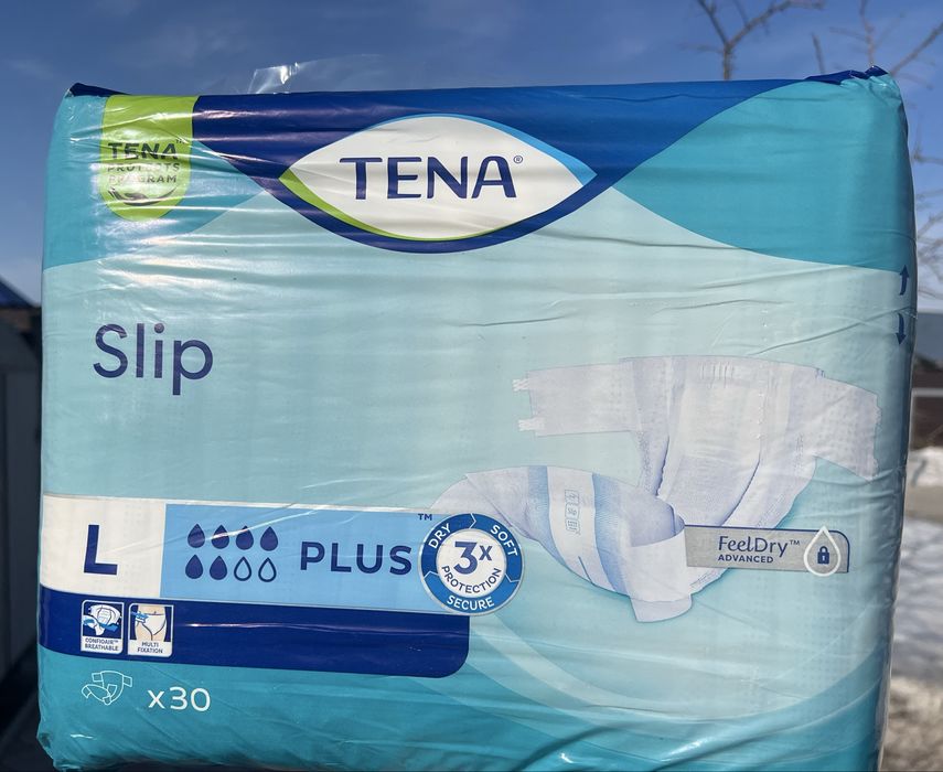 Продам памперсы Tena L размер