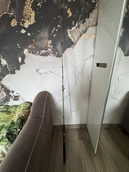 Спиннинг крокодил фирмы Okuma