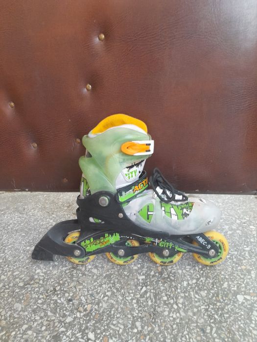 Роликовые коньки Action PW-395 (р. 36-40, черный/зеленый/белый)