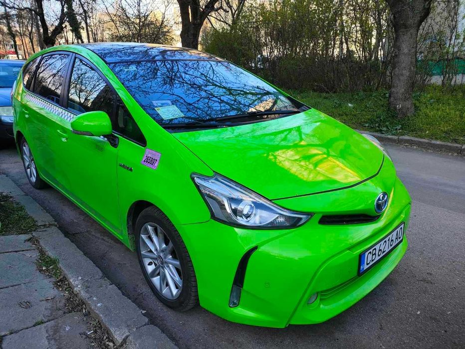 Такси под Аренда към Taxi Me,Toyota Prius+,7 Местен,Хибрид плюс Газ-68лв/35 евро на ден