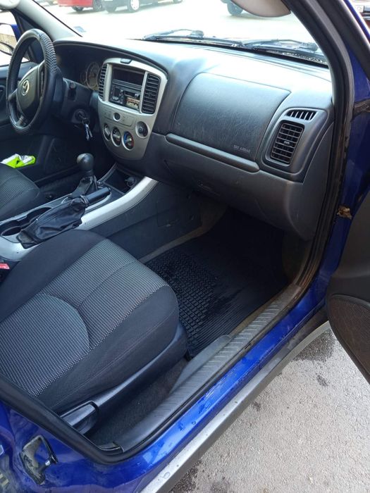 Кола Mazda Tribute