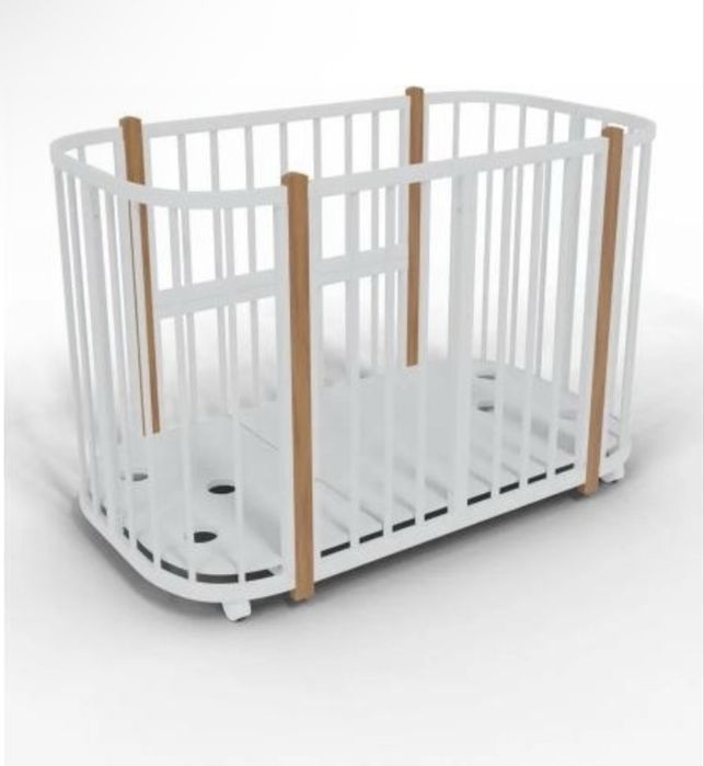 Детская кроватка с маятником