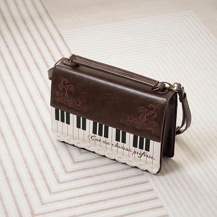 женский кожаный рюкзак сумка с клавишами пианино оригинальный 
ориенти