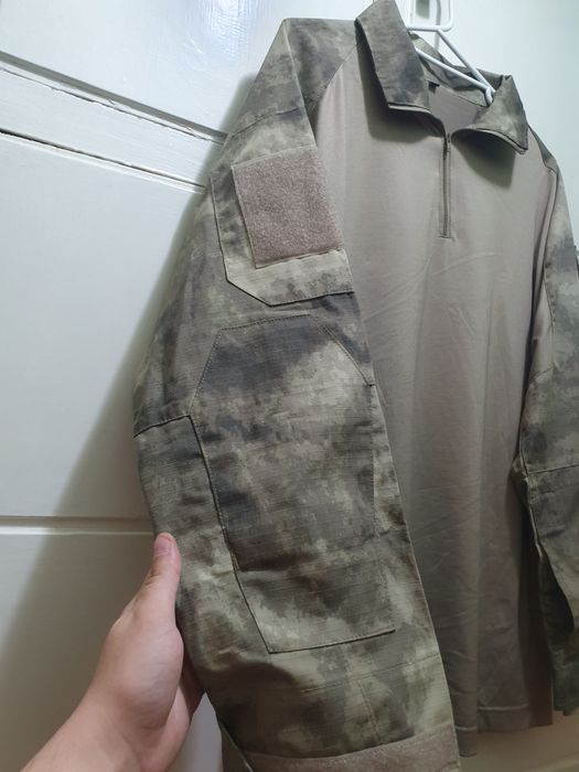 Bluză tactică de la  101 INC pe camuflaj Atacs AU